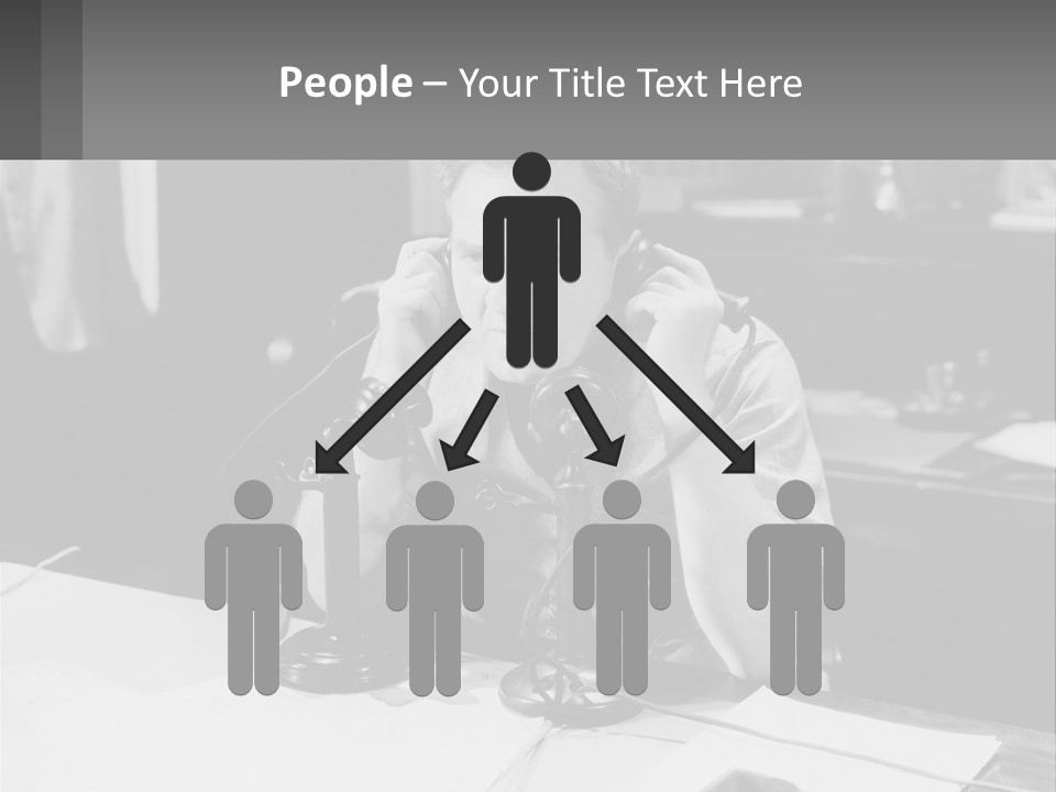 A Man Sitting At A Desk Talking On A Phone PowerPoint Template