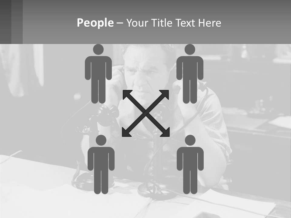A Man Sitting At A Desk Talking On A Phone PowerPoint Template