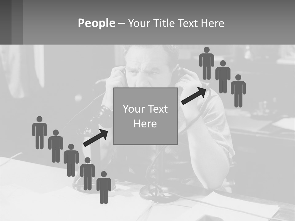 A Man Sitting At A Desk Talking On A Phone PowerPoint Template