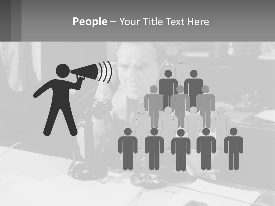 A Man Sitting At A Desk Talking On A Phone PowerPoint Template