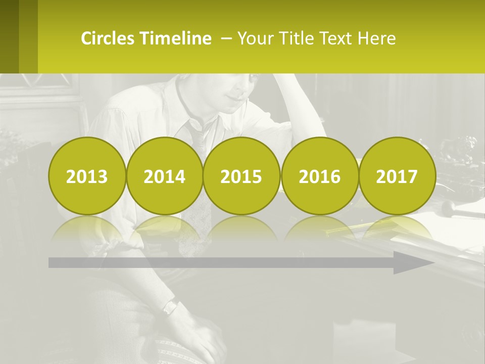 A Man Sitting At A Desk With A Typewriter PowerPoint Template