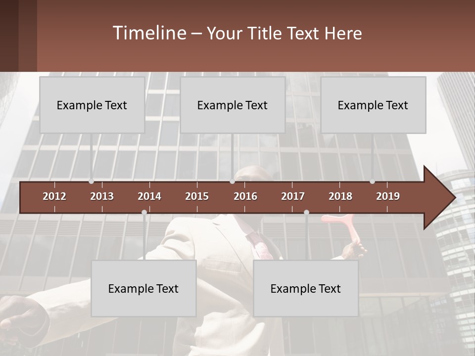 A Man In A Suit Holding Up A Red Object In Front Of A Tall Building PowerPoint Template