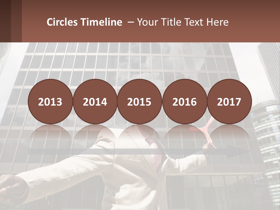 A Man In A Suit Holding Up A Red Object In Front Of A Tall Building PowerPoint Template