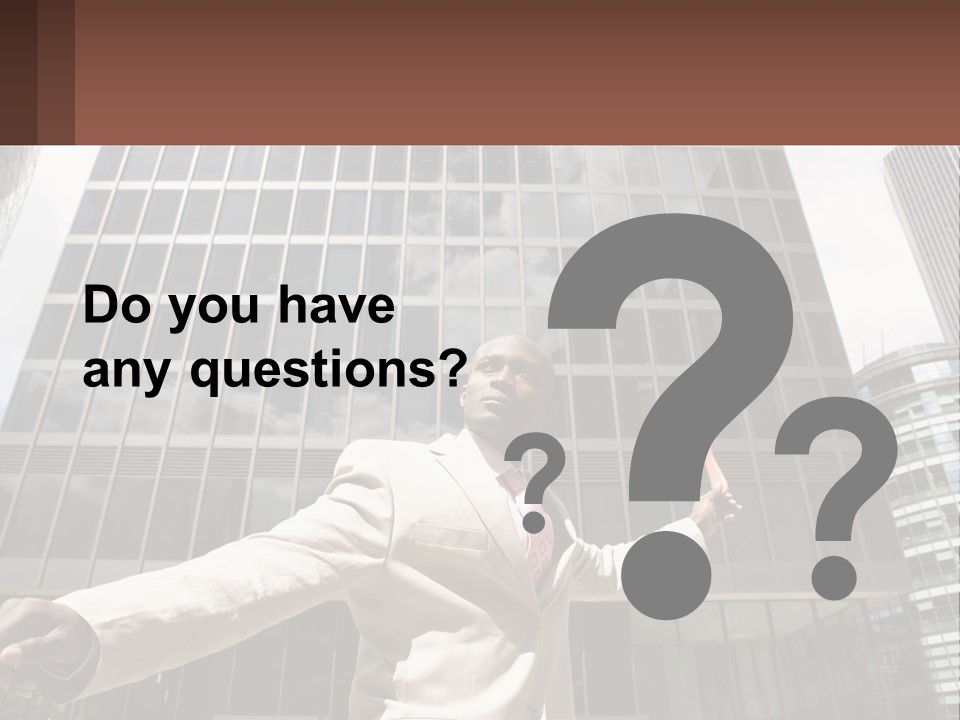 A Man In A Suit Holding Up A Red Object In Front Of A Tall Building PowerPoint Template