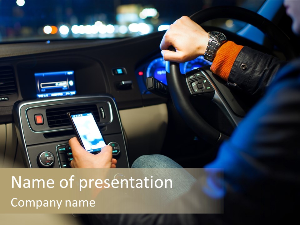 A Person Using A Cell Phone While Driving A Car PowerPoint Template