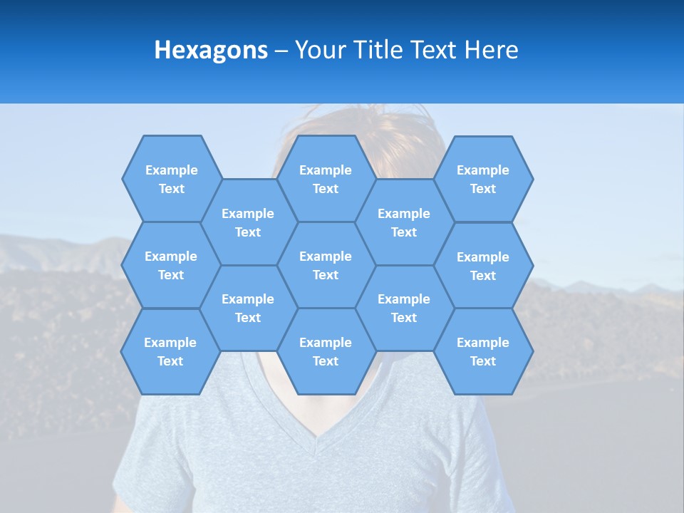 A Young Boy Standing In Front Of A Mountain PowerPoint Template