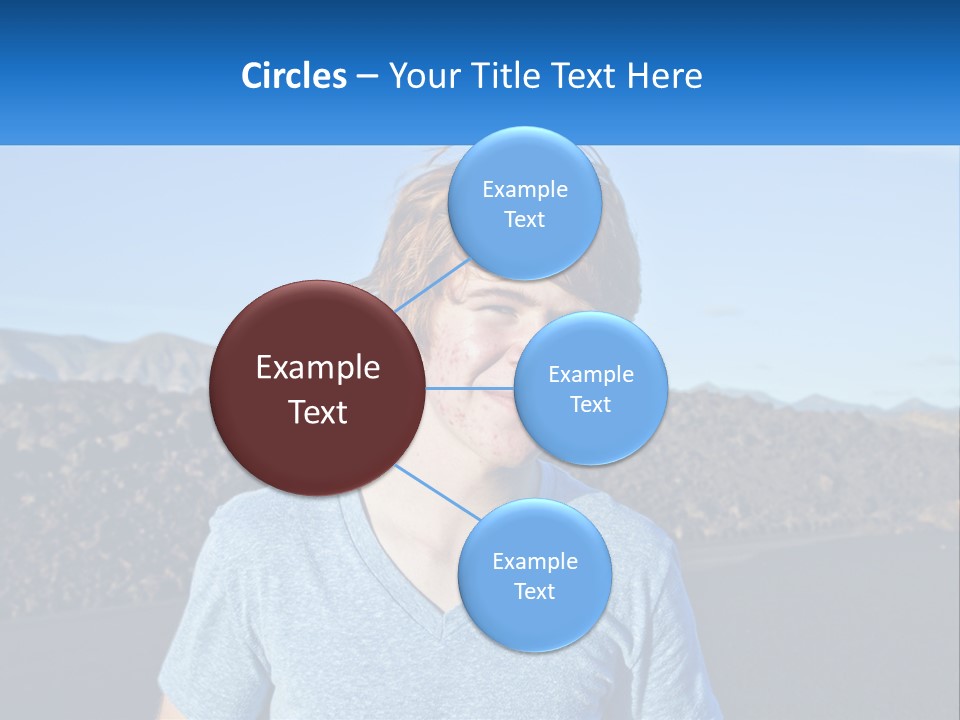 A Young Boy Standing In Front Of A Mountain PowerPoint Template