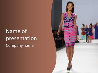 A Woman Walking Down A Runway In A Colorful Dress PowerPoint Template