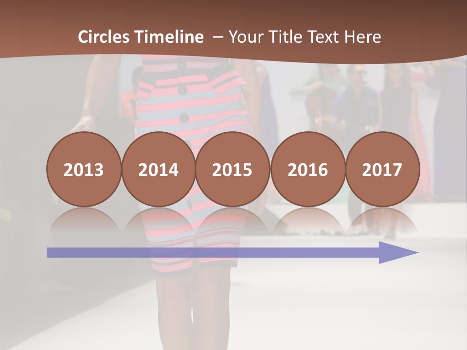 A Woman Walking Down A Runway In A Colorful Dress PowerPoint Template