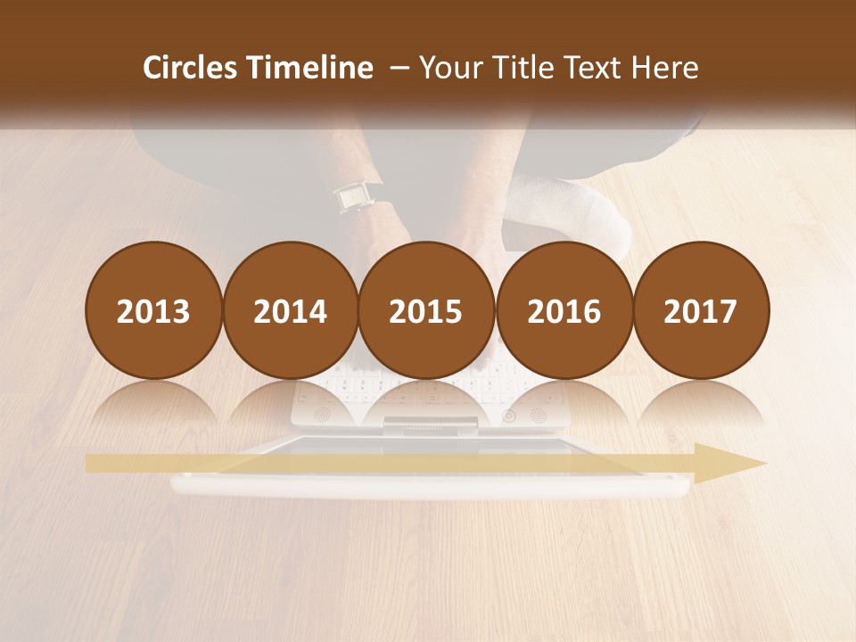 A Person Sitting On The Floor Using A Laptop PowerPoint Template