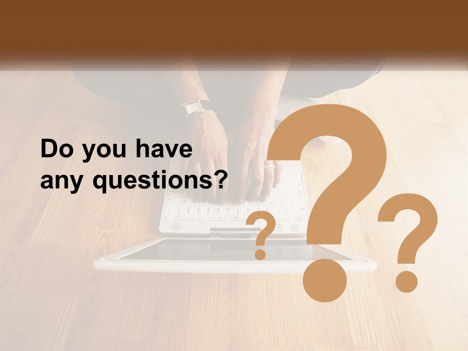 A Person Sitting On The Floor Using A Laptop PowerPoint Template