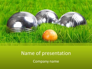 A Group Of Metal Balls Sitting In The Grass PowerPoint Template