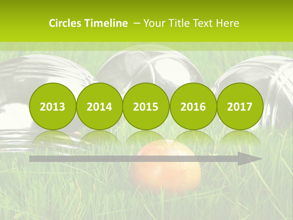A Group Of Metal Balls Sitting In The Grass PowerPoint Template