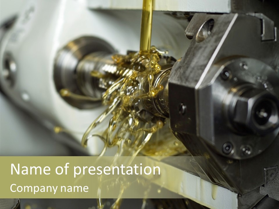 A Machine That Is Pouring Oil On A Piece Of Machinery PowerPoint Template