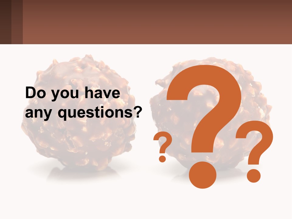 Two Chocolate Balls With Nuts On Top Of Them PowerPoint Template