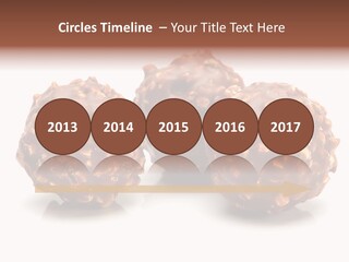 Three Chocolate Balls With Nuts On A White Background PowerPoint Template