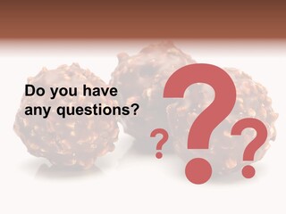 Three Chocolate Balls With Nuts On A White Background PowerPoint Template