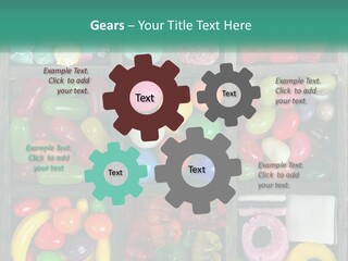 A Wooden Box Filled With Lots Of Candy PowerPoint Template