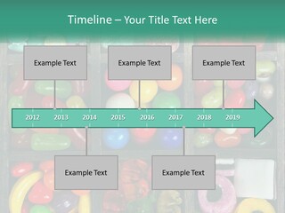 A Wooden Box Filled With Lots Of Candy PowerPoint Template