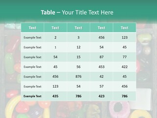 A Wooden Box Filled With Lots Of Candy PowerPoint Template