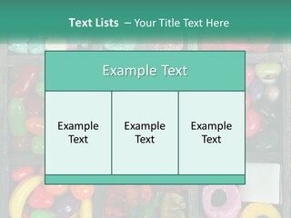 A Wooden Box Filled With Lots Of Candy PowerPoint Template