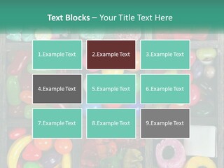 A Wooden Box Filled With Lots Of Candy PowerPoint Template