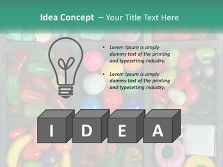 A Wooden Box Filled With Lots Of Candy PowerPoint Template