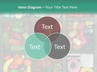 A Wooden Box Filled With Lots Of Candy PowerPoint Template