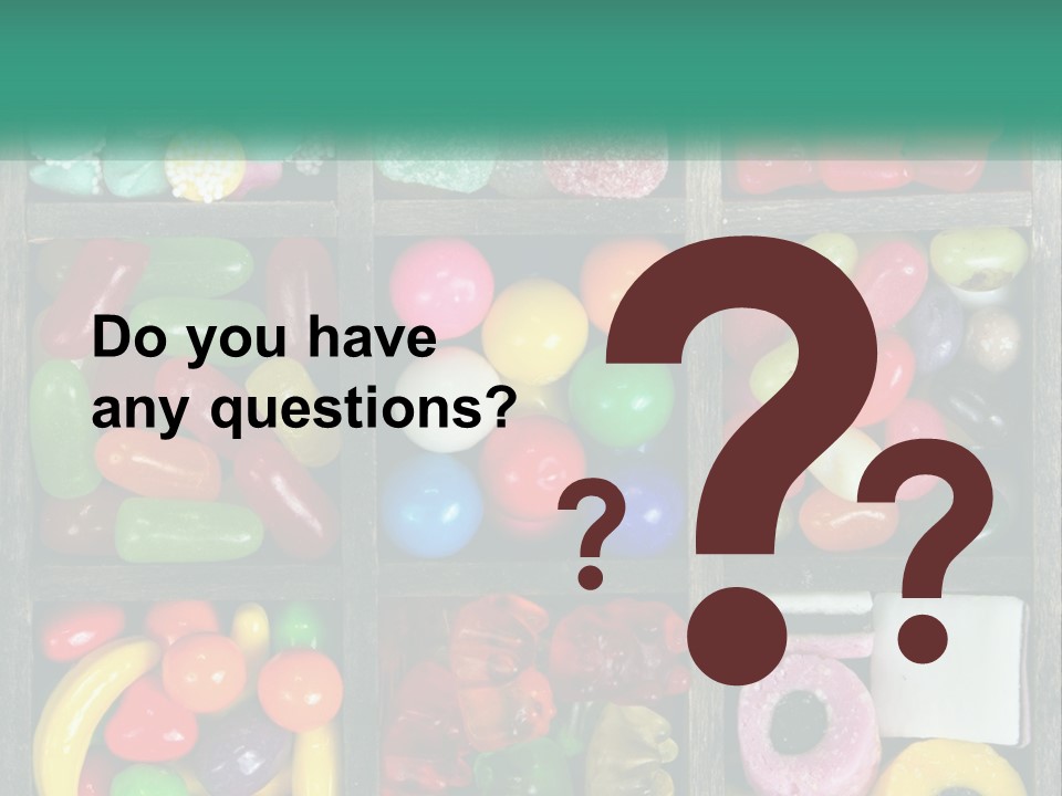 A Wooden Box Filled With Lots Of Candy PowerPoint Template