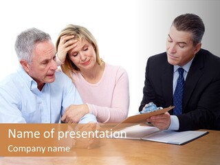 A Couple Of People Sitting At A Table PowerPoint Template