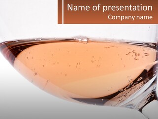 A Glass Of White Wine With A Brown Label On It PowerPoint Template