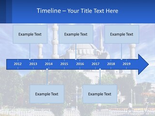 A Large White Building With A Blue Sky In The Background PowerPoint Template