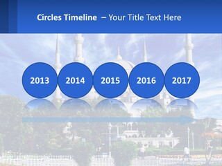 A Large White Building With A Blue Sky In The Background PowerPoint Template