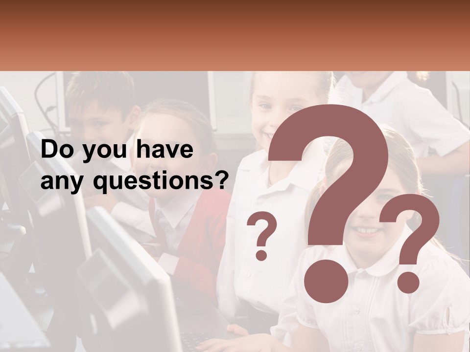 A Group Of Children Sitting In Front Of A Computer PowerPoint Template