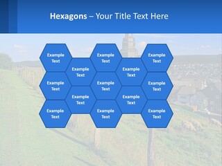 A Church On A Hill With Sheep Grazing In The Foreground PowerPoint Template