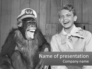 A Man Sitting Next To A Monkey With A Hat On PowerPoint Template