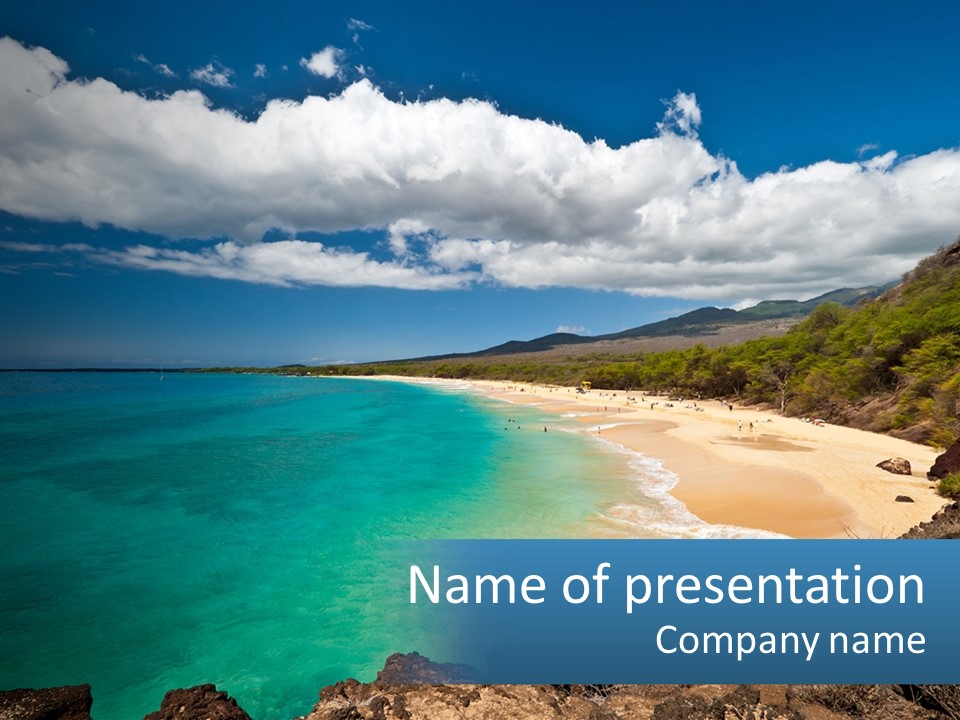 A Sandy Beach With Blue Water On A Sunny Day PowerPoint Template