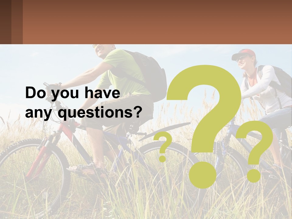 A Couple Of People Riding Bikes Through A Field PowerPoint Template
