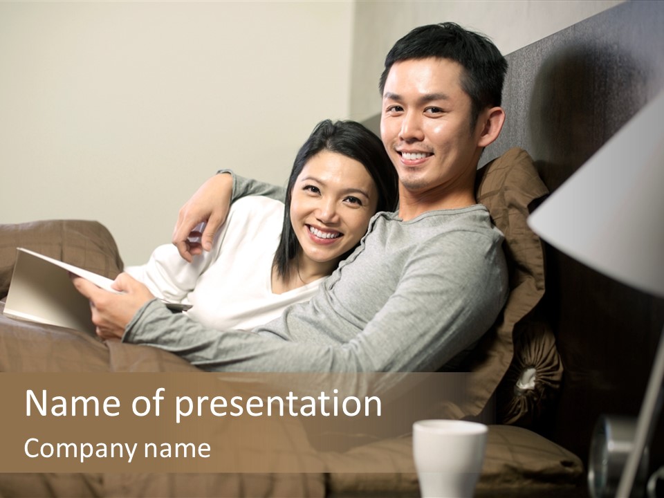 A Man And A Woman Sitting On A Couch PowerPoint Template