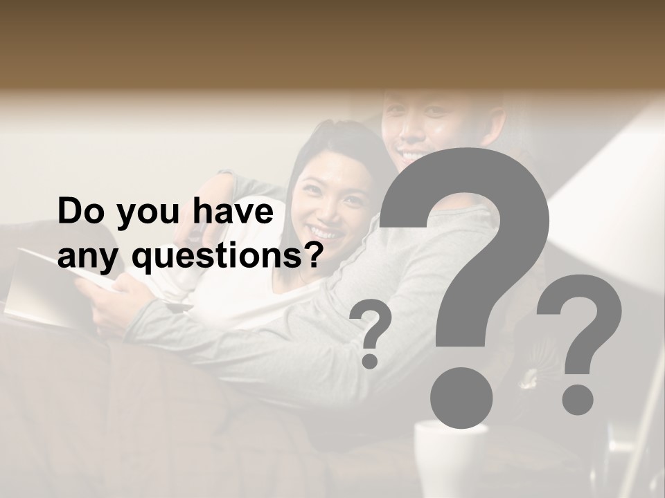 A Man And A Woman Sitting On A Couch PowerPoint Template