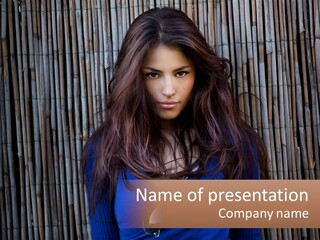 A Woman With Long Hair Standing In Front Of A Bamboo Wall PowerPoint Template