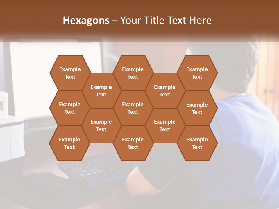 A Young Boy Sitting At A Desk With A Computer PowerPoint Template