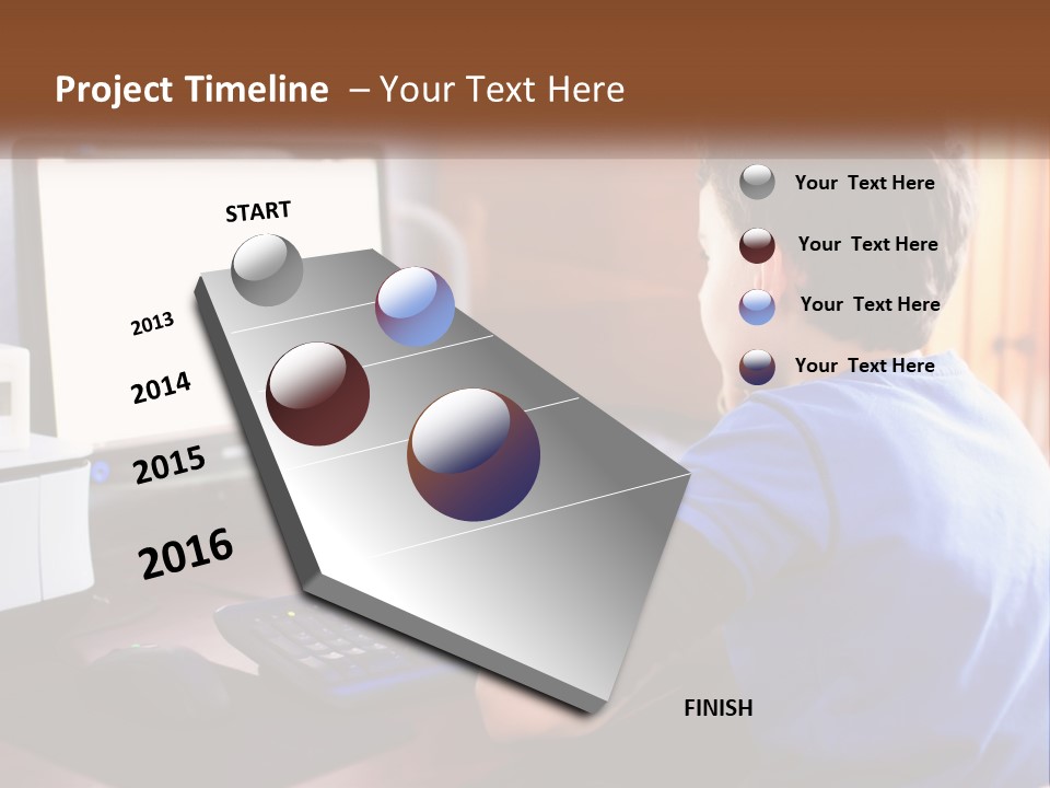 A Young Boy Sitting At A Desk With A Computer PowerPoint Template