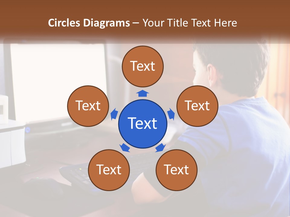 A Young Boy Sitting At A Desk With A Computer PowerPoint Template