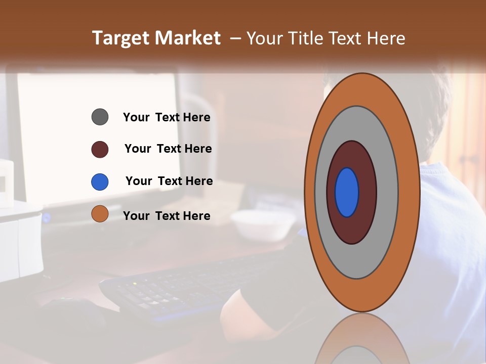 A Young Boy Sitting At A Desk With A Computer PowerPoint Template