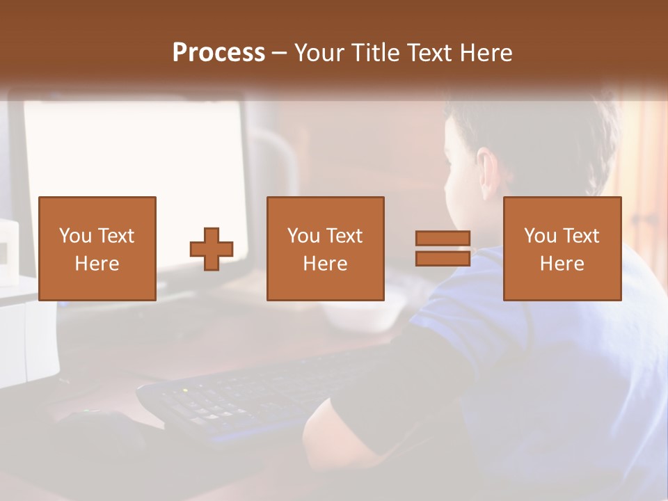 A Young Boy Sitting At A Desk With A Computer PowerPoint Template