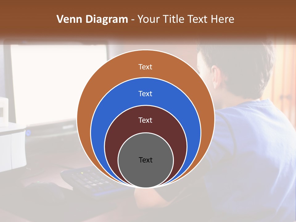 A Young Boy Sitting At A Desk With A Computer PowerPoint Template
