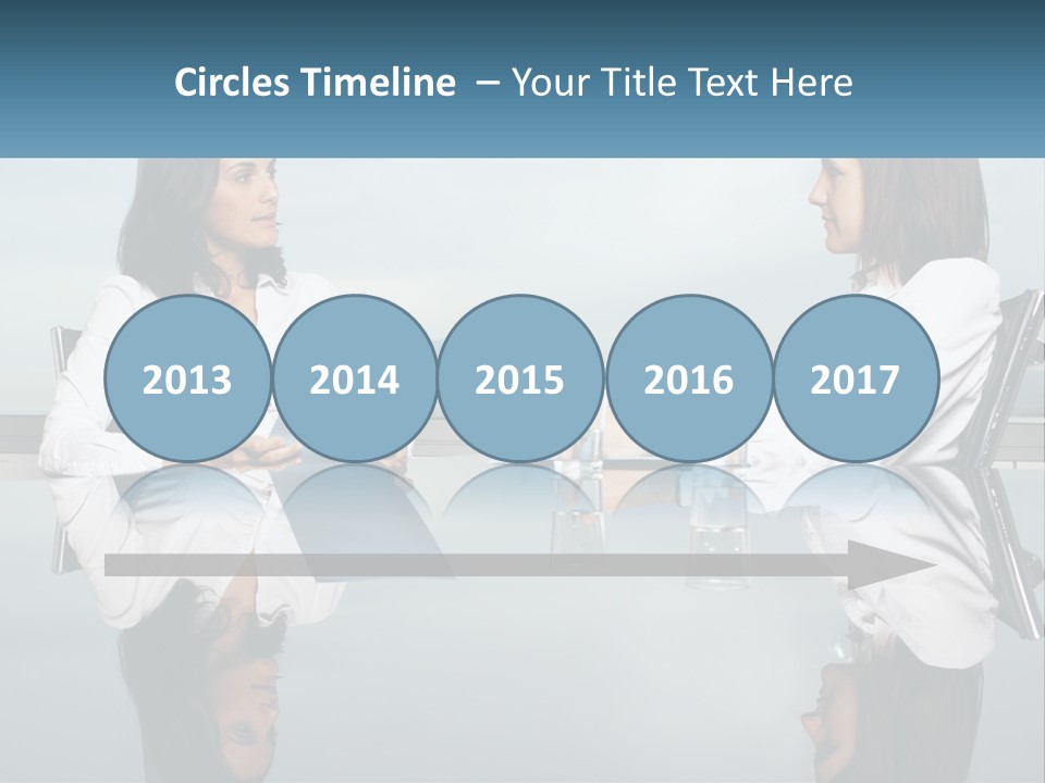 Two Women Sitting At A Table With Papers In Front Of Them PowerPoint Template