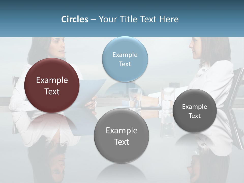 Two Women Sitting At A Table With Papers In Front Of Them PowerPoint Template