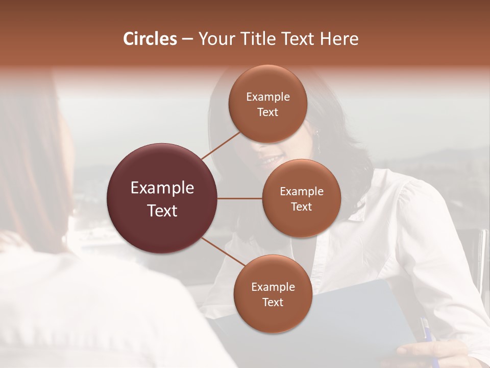 A Woman Sitting At A Desk Talking To Another Woman PowerPoint Template